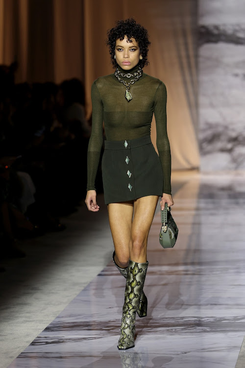 A model walks the runway at the Roberto Cavalli fashion show during Milan Fashion Week.