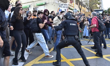 Barcelona police criticised for baton charge at protest over fashion show