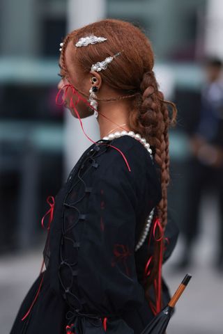 Red hair woman with baby braids and plaits GettyImages-1688892054