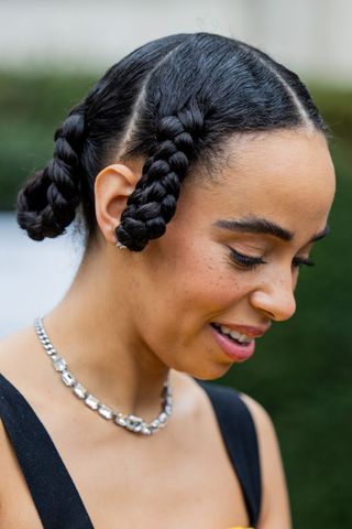 Black haired woman with twisted hoop braids GettyImages-2018780028