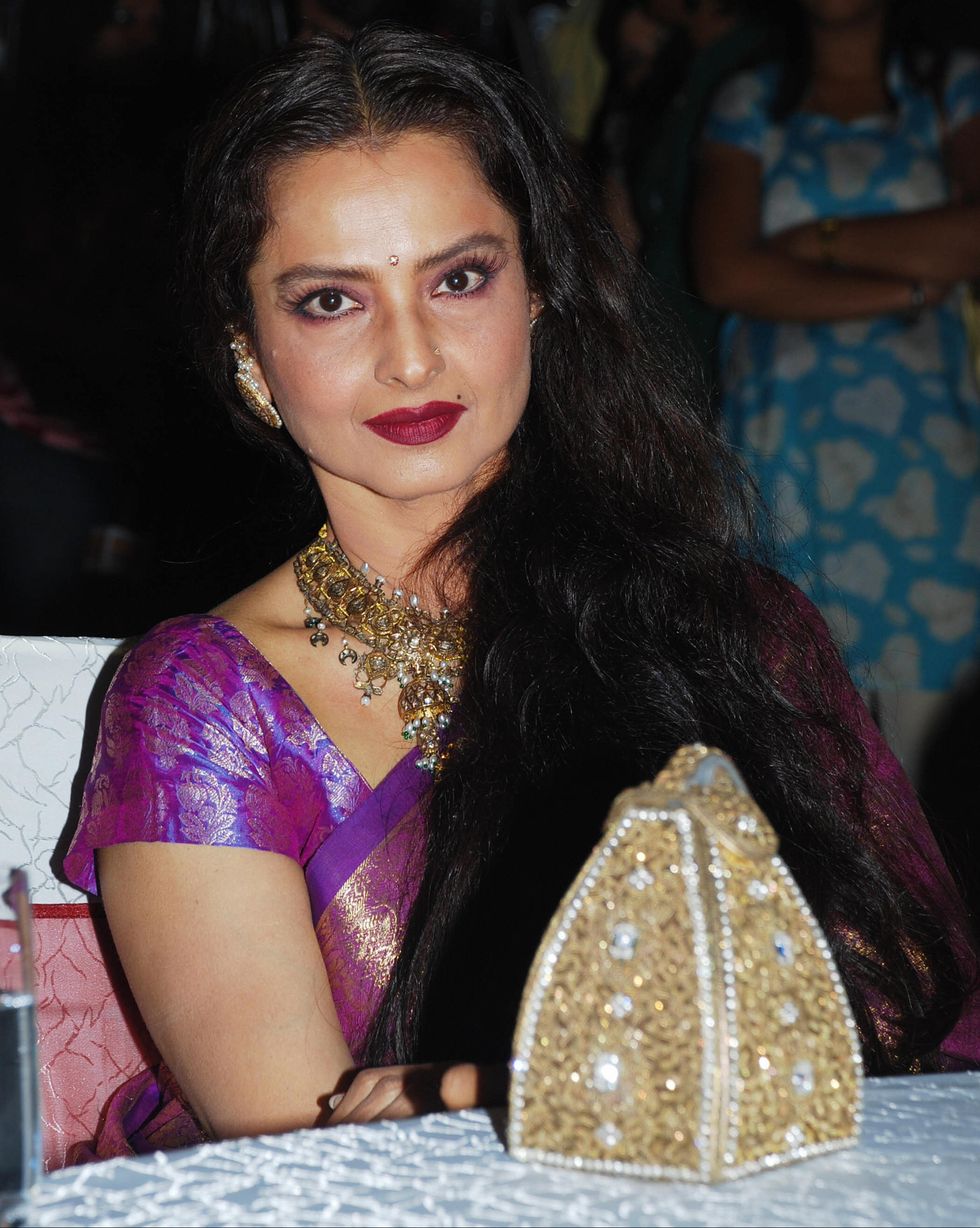 indian actress rekha attends a party honouring bollywood actor shatrughan sinhas election to the national parliament the lok sabha and to mark the completion of the film aaj phir jeene ki tamanna hai at novotel hotel in mumbai on july 11, 2009 afp photostr photo credit should read strafp via getty images