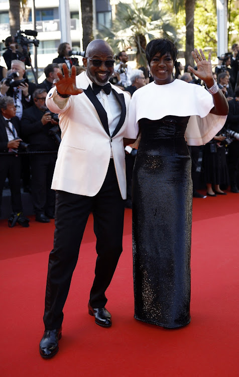 Viola Davis and Julius Tennon pose on the red carpet to attend the closing ceremony of the 77th Cannes Film Festival.