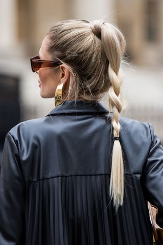 Blonde woman with loose plait GettyImages-1961123362