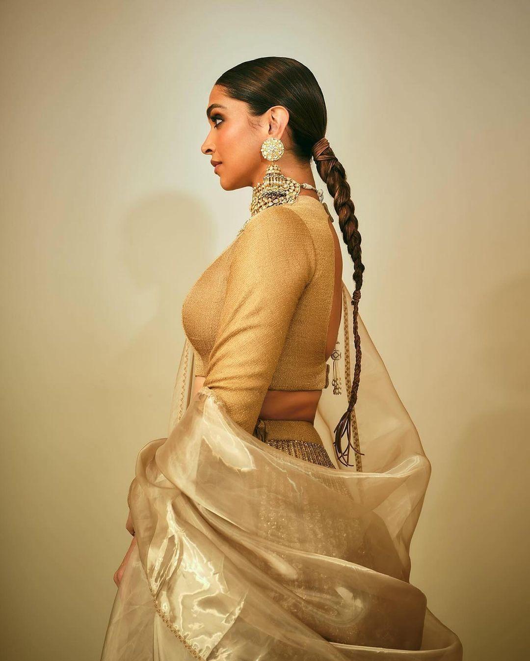 She paired it with a black and golden skirt adorned with intricate craftsmanship, and a plain golden silk dupatta completed her royal queen-like appearance.