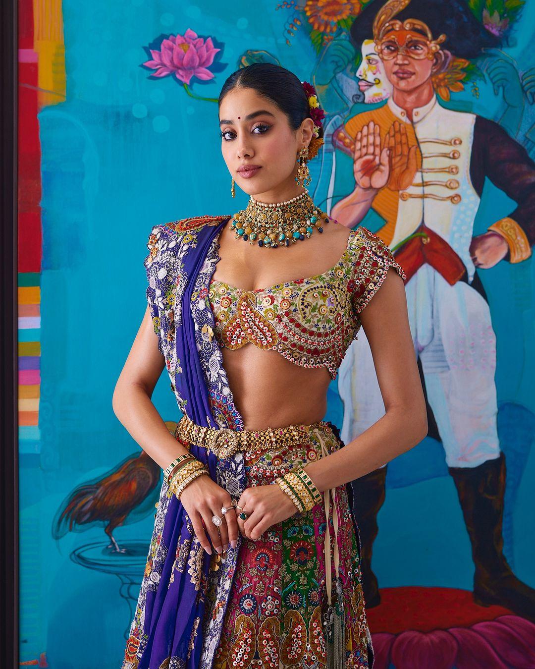  The multi-coloured outfit showcases intricate Gujarati prints and the designer's signature lace details.