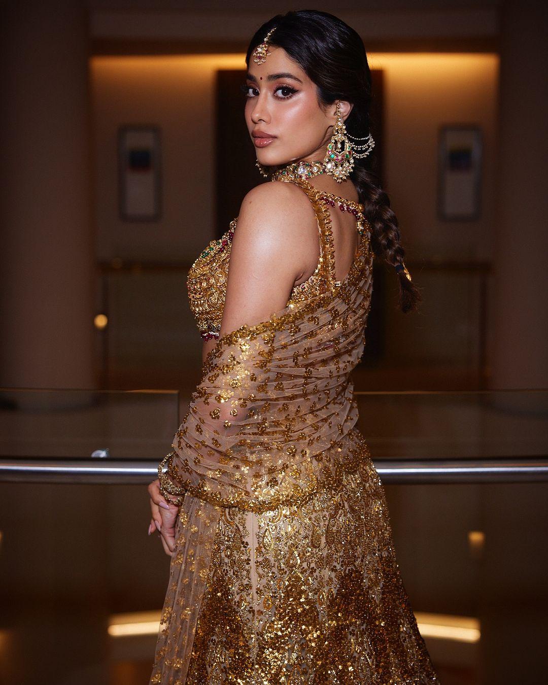 Matching gold jewelry added a regal touch, including bold earrings, bangles, a stunning necklace, and a maang tikka that completed her ensemble.