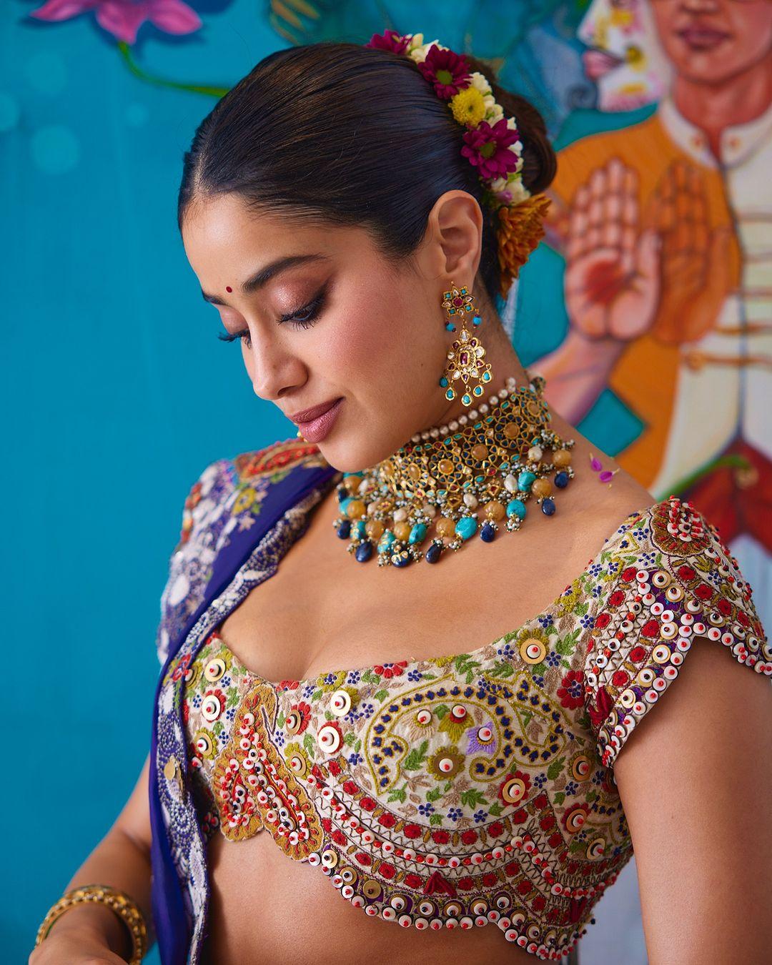 For Anant and Radhika's mehendi ceremony, Janhvi Kapoor chose a vibrant lehenga designed by Anamika Khanna. 