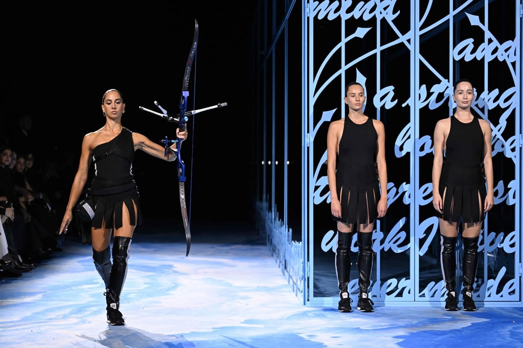 Italian Instagram artist Sagg Napoli opened the Dior spring/summer 2025 show in Paris with an archery-inspired performance. Photo: AFP