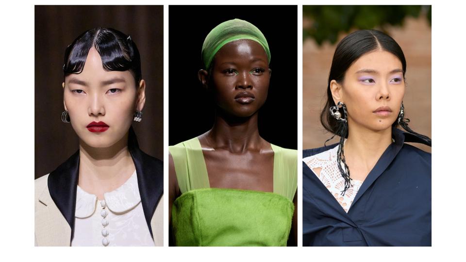 three models with red lips, green eyeliner and purple eyeshadow from the Milan fashion week runways