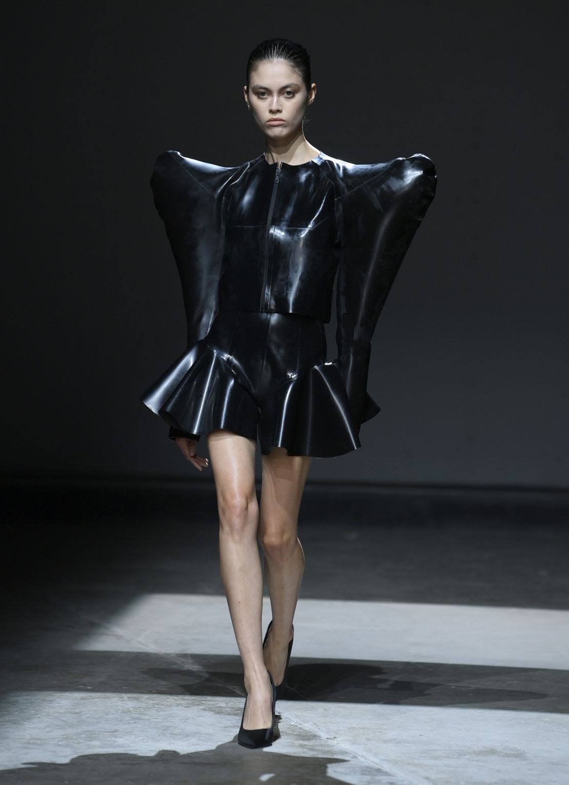 There was a mix on show, from exaggerated silhouettes to more wearable pieces — all rendered in monochromatic latex.