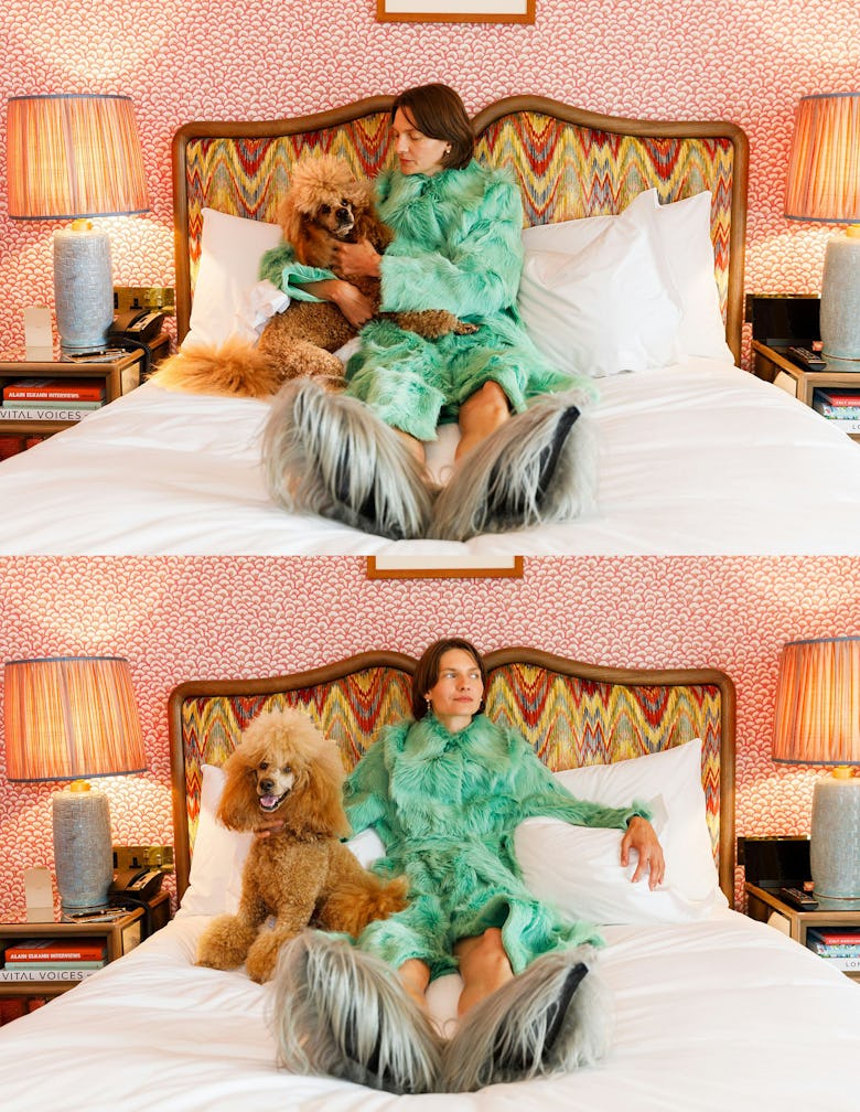 Woman in bed with dog