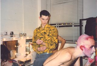 Mike Nichols in a yellow shirt and Matthew Hawkins wearing purple make-up